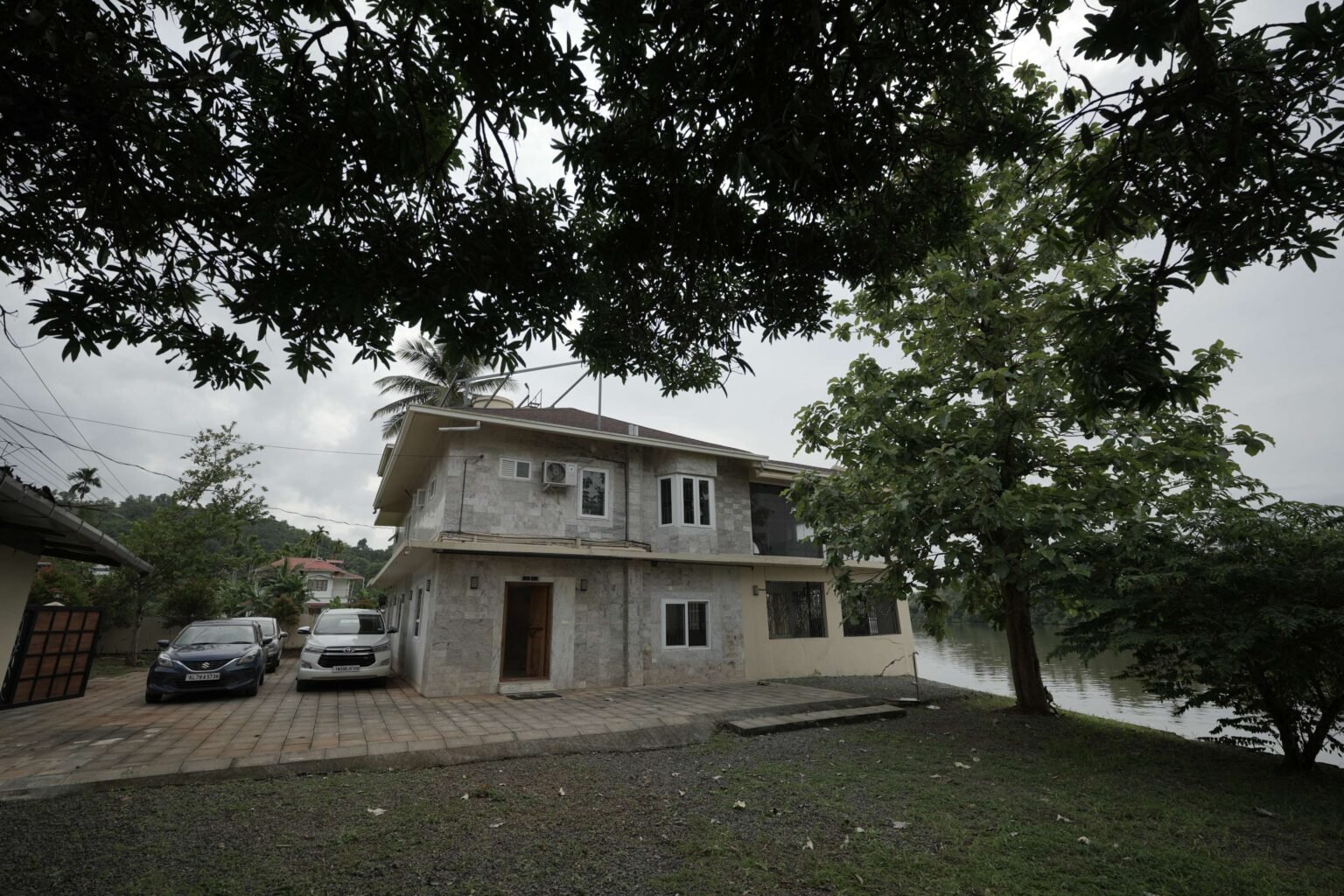 The garden and shade trees in front of the house