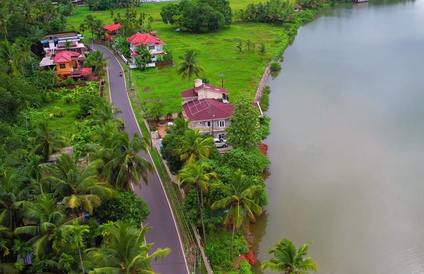 The house and garden from above, beside the river