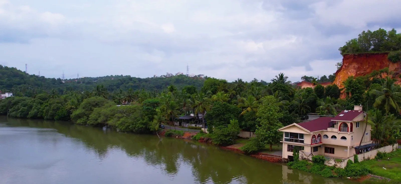 The house on the riverbank, seen from the water