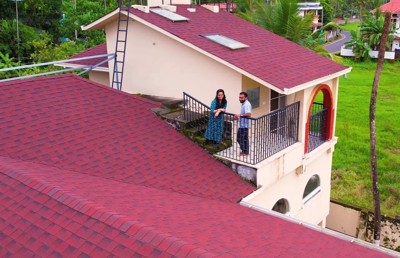 Guests on the terrace above the red roof